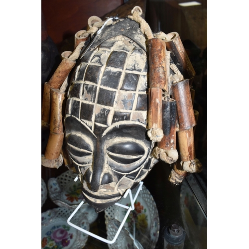 923 - A CHOKWE MWANA PWO MASK, ANGOLA with hand-carved grid patterns, fifteen bamboo 'hair' strands strung... 