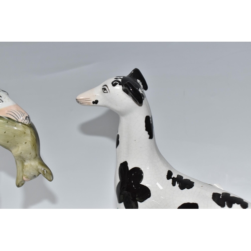 924 - A PAIR OF STAFFORDSHIRE 'DISRAELI CURL' GREYHOUND FIGURES comprising a left and right facing hound, ... 