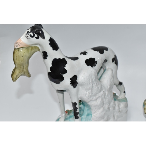 924 - A PAIR OF STAFFORDSHIRE 'DISRAELI CURL' GREYHOUND FIGURES comprising a left and right facing hound, ... 