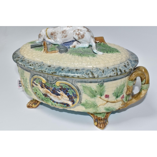 925 - A MINTON MAJOLICA LIDDED GAME PIE TUREEN with a moulded gundog handle to the lid, with two twisted h... 