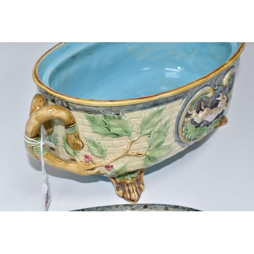 925 - A MINTON MAJOLICA LIDDED GAME PIE TUREEN with a moulded gundog handle to the lid, with two twisted h... 