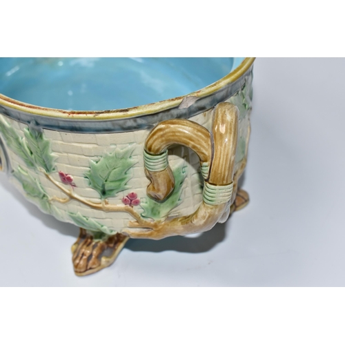 925 - A MINTON MAJOLICA LIDDED GAME PIE TUREEN with a moulded gundog handle to the lid, with two twisted h... 