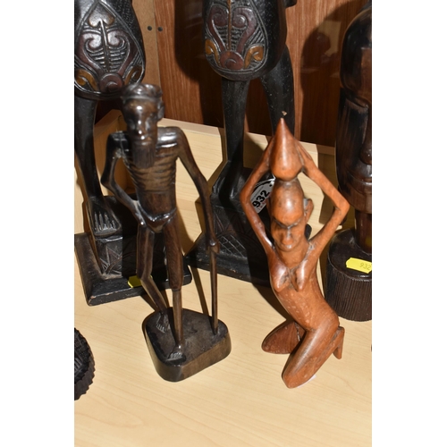 932 - A GROUP OF MOSTLY MID TWENTIETH CENTURY WEST AFRICAN WOODEN SCULPTURES comprising a pair of two knee... 