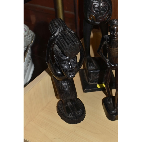 932 - A GROUP OF MOSTLY MID TWENTIETH CENTURY WEST AFRICAN WOODEN SCULPTURES comprising a pair of two knee... 