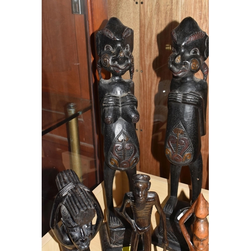 932 - A GROUP OF MOSTLY MID TWENTIETH CENTURY WEST AFRICAN WOODEN SCULPTURES comprising a pair of two knee... 