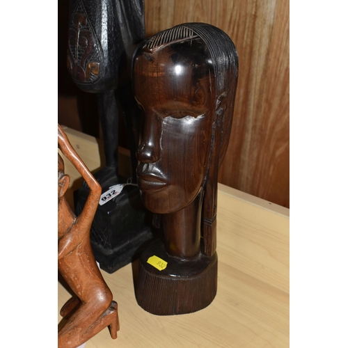 932 - A GROUP OF MOSTLY MID TWENTIETH CENTURY WEST AFRICAN WOODEN SCULPTURES comprising a pair of two knee... 