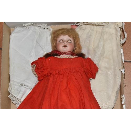 933 - A GERMAN BISQUE HEAD DOLL AND CLOTHES, the doll has an open mouth with four teeth showing, painted l... 