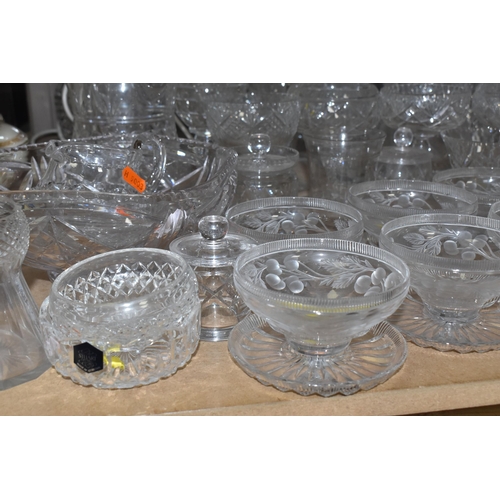 939 - A COLLECTION OF CUT GLASS AND ETCHED GLASSWARE, to include decanters, grapefruit dishes, large punch... 