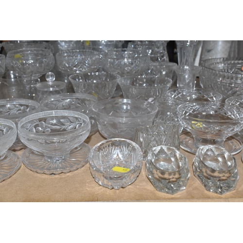 939 - A COLLECTION OF CUT GLASS AND ETCHED GLASSWARE, to include decanters, grapefruit dishes, large punch... 