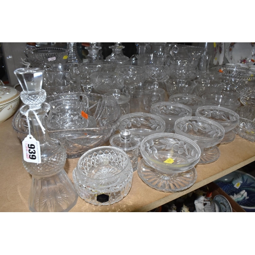 939 - A COLLECTION OF CUT GLASS AND ETCHED GLASSWARE, to include decanters, grapefruit dishes, large punch... 