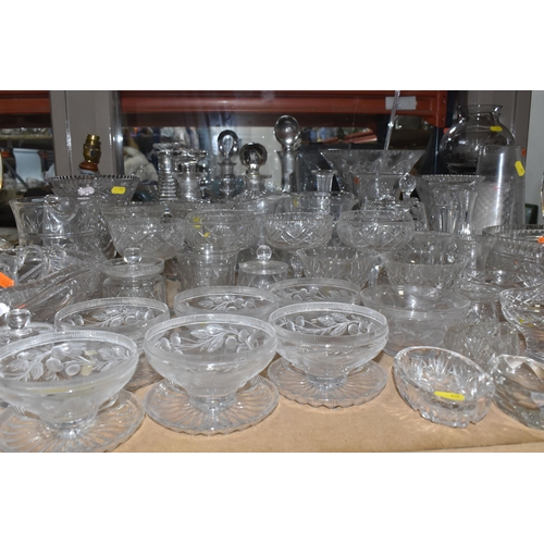 939 - A COLLECTION OF CUT GLASS AND ETCHED GLASSWARE, to include decanters, grapefruit dishes, large punch... 