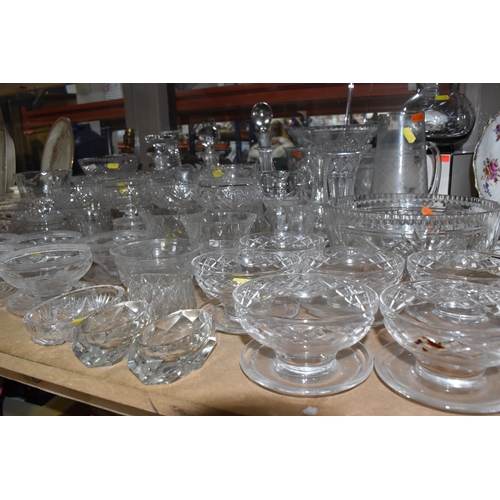 939 - A COLLECTION OF CUT GLASS AND ETCHED GLASSWARE, to include decanters, grapefruit dishes, large punch... 