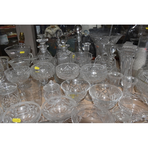 939 - A COLLECTION OF CUT GLASS AND ETCHED GLASSWARE, to include decanters, grapefruit dishes, large punch... 