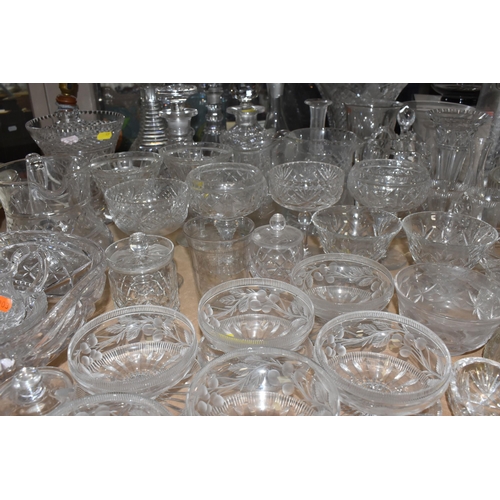 939 - A COLLECTION OF CUT GLASS AND ETCHED GLASSWARE, to include decanters, grapefruit dishes, large punch... 