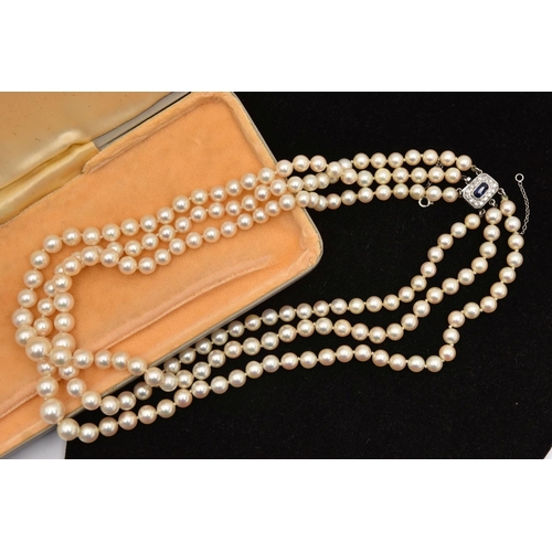 583 - A THREE STRAND CULTURED PEARL NECKLACE, three strands of individually knotted, graduated cream pearl... 