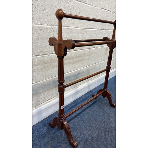 184 - A VICTORIAN MAHOGANY TOWEL RAIL, with four rails, raised on tapered and fluted supports, height 91cm... 