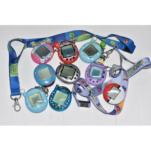 757 - A BOX OF TAMAGOTCHIS AND A POKE WALKER, four of the Tamagotchis and the Poke Walker are in working c... 