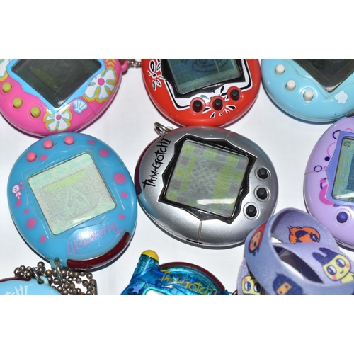 757 - A BOX OF TAMAGOTCHIS AND A POKE WALKER, four of the Tamagotchis and the Poke Walker are in working c... 