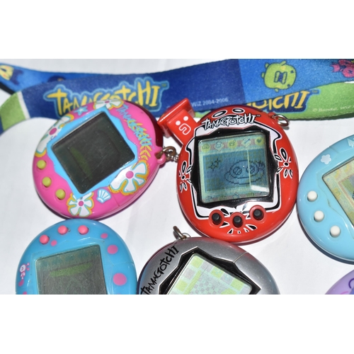 757 - A BOX OF TAMAGOTCHIS AND A POKE WALKER, four of the Tamagotchis and the Poke Walker are in working c... 