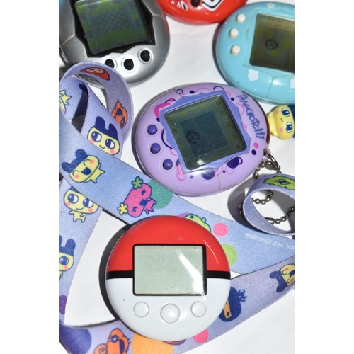 757 - A BOX OF TAMAGOTCHIS AND A POKE WALKER, four of the Tamagotchis and the Poke Walker are in working c... 