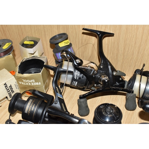 769 - A GROUP OF FISHING REELS, to include a Fox Santos 3200FD reel (as new with tag attached), a Shimano ... 