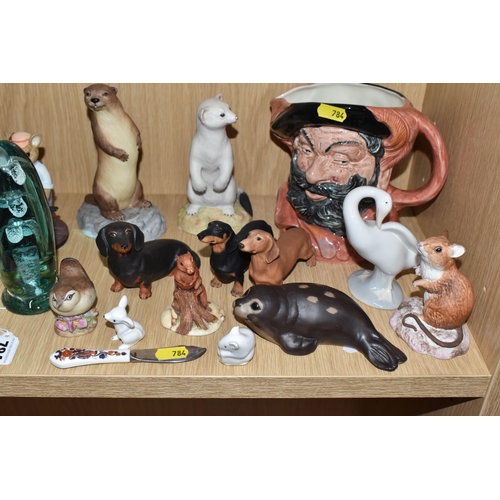 784 - A COLLECTION OF ANIMAL FIGURES, CERAMICS AND GLASS, to include a Victorian glass dump weight, height... 