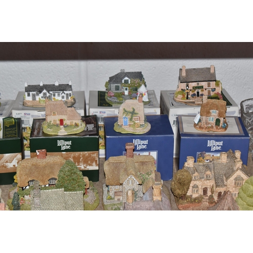 853 - A COLLECTION OF LILLIPUT LANE COTTAGES, comprising boxed cottages: The Crooked House, The Cuddy, Man... 