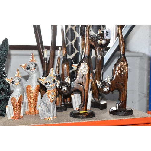 860 - A COLLECTION OF CAT FIGURES, thirteen mostly wooden, tallest approximately 69cm, together with a han... 