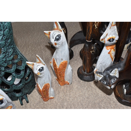 860 - A COLLECTION OF CAT FIGURES, thirteen mostly wooden, tallest approximately 69cm, together with a han... 