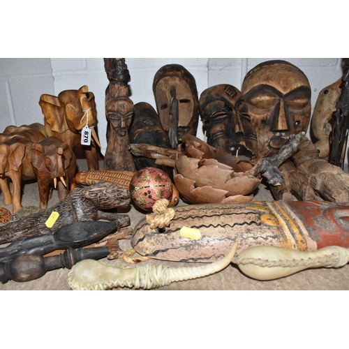 870 - A GROUP OF DECORATIVE AFRICAN SCULPTURES, comprising a selection of masks, animal sculptures, figure... 