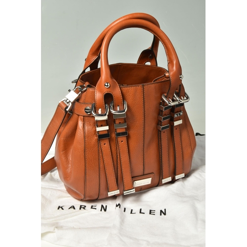 586 - KAREN MILLEN: TWO LEATHER HANDBAGS: a tan leather handbag with removable shoulder strap, silver tone... 