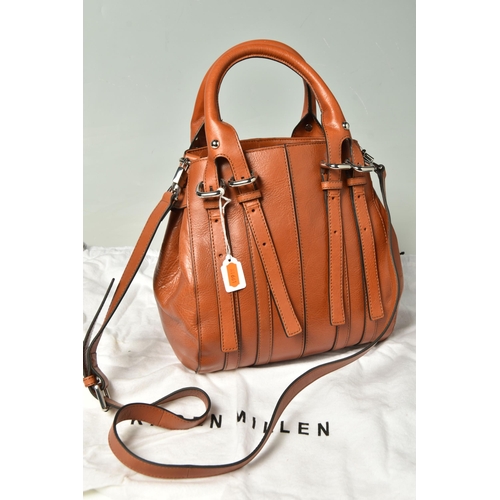 586 - KAREN MILLEN: TWO LEATHER HANDBAGS: a tan leather handbag with removable shoulder strap, silver tone... 