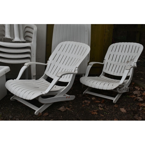 12 - A SELECTION OF WHITE PLASTIC GARDEN FURNITURE, to include a rectangular table, two sets of four stac... 