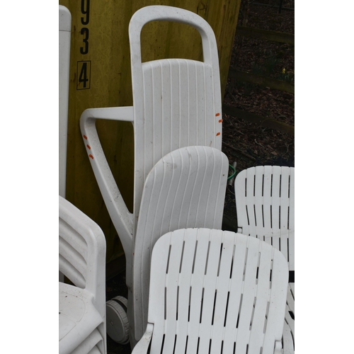 12 - A SELECTION OF WHITE PLASTIC GARDEN FURNITURE, to include a rectangular table, two sets of four stac... 