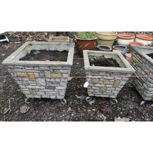15 - A SET OF THREE BRICK EFFECT SQUARE TAPERED PLANTERS, on metal legs, largest pots 40cm squared x heig... 