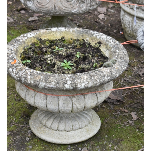 20 - TWO WEATHERED COMPOSITE CAMPAGNA GARDEN URNS, on separate bases, largest diameter 47cm x height 38, ... 
