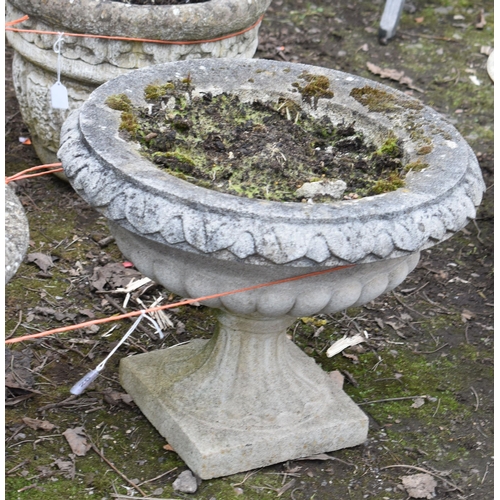 20 - TWO WEATHERED COMPOSITE CAMPAGNA GARDEN URNS, on separate bases, largest diameter 47cm x height 38, ... 