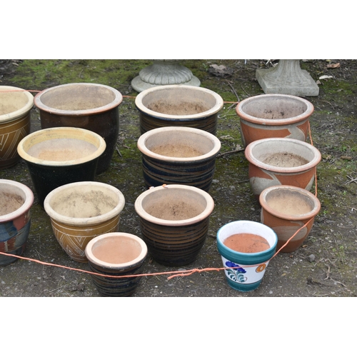 8 - SIXTEEN GLAZED PLANT POTS, of various sizes, patterns and colours, and a plastic plant pot (17)