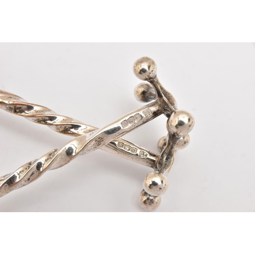446 - A PAIR OF EARLY 20TH CENTURY SILVER KNIFE RESTS, twist detail with beaded terminals, hallmarked 'Coo... 