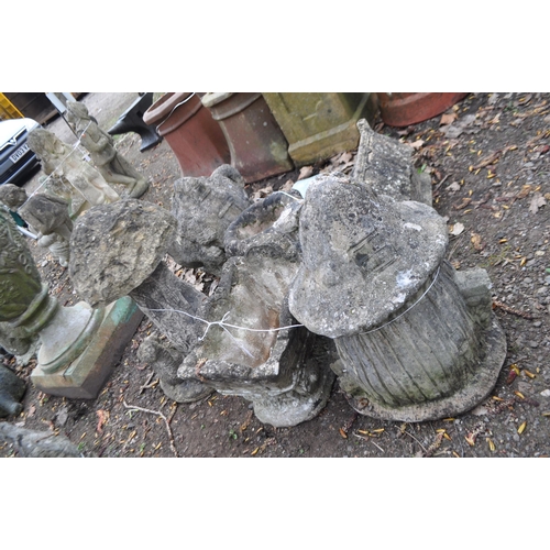 36 - A COLLECTION OF SIX NOVELTY CONCRETE GARDEN ORNAMENTS, including a watering can, a cottage tea pot, ... 