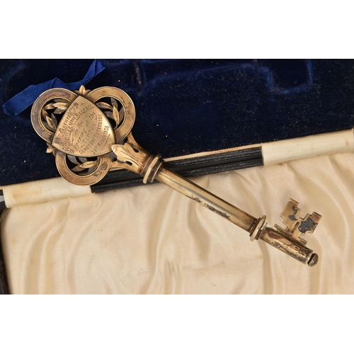 A CASED GILT PRESENTATION KEY, engraved initials and personal engraving ...