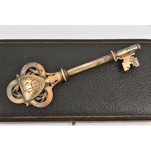 A CASED GILT PRESENTATION KEY, engraved initials and personal engraving ...