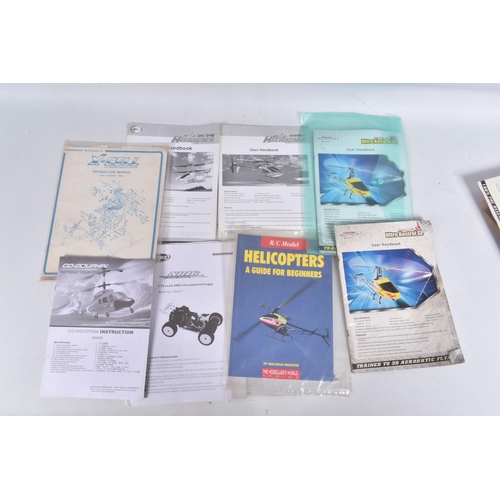 174 - SIX TRAYS CONTAINING RC HELICOPTER PARTS including nose cones, tail rods, rotors, engine parts, manu...