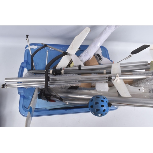 174 - SIX TRAYS CONTAINING RC HELICOPTER PARTS including nose cones, tail rods, rotors, engine parts, manu...