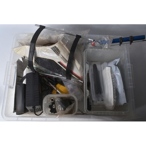 174 - SIX TRAYS CONTAINING RC HELICOPTER PARTS including nose cones, tail rods, rotors, engine parts, manu...