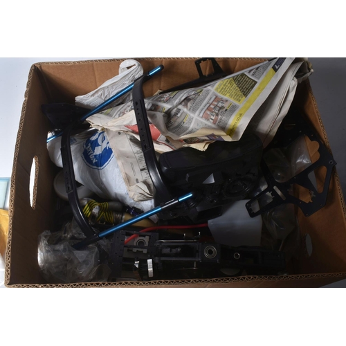 174 - SIX TRAYS CONTAINING RC HELICOPTER PARTS including nose cones, tail rods, rotors, engine parts, manu...