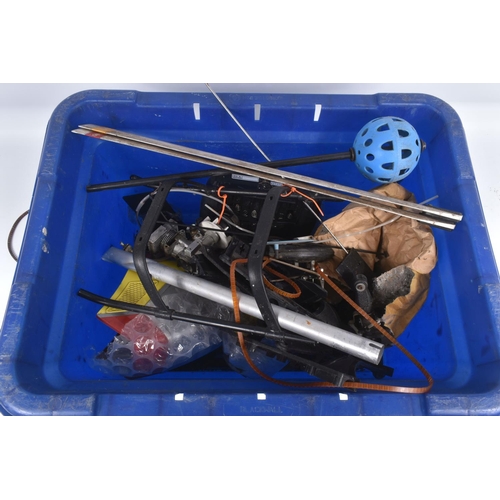 174 - SIX TRAYS CONTAINING RC HELICOPTER PARTS including nose cones, tail rods, rotors, engine parts, manu...