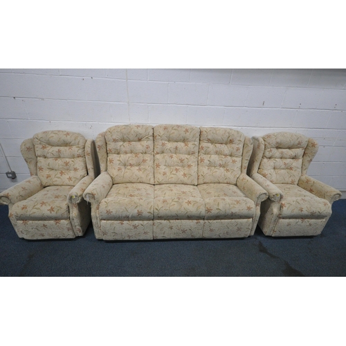 151 - A BEIGE AND FOLIATE UPHOLSTERED THREE PIECE WING BACK LOUNGE SUITE, comprising a three seater sofa, ... 