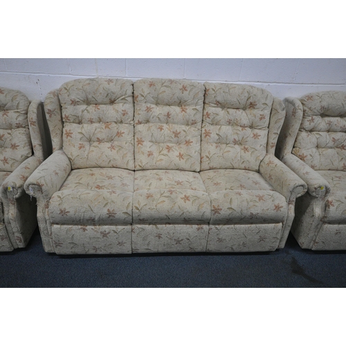151 - A BEIGE AND FOLIATE UPHOLSTERED THREE PIECE WING BACK LOUNGE SUITE, comprising a three seater sofa, ... 