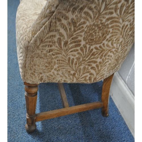 156 - A PAIR OF EARLY 2OTH CENTURY TUB CHAIRS, with foliate upholstery, raised on oak legs, width 67cm x d... 